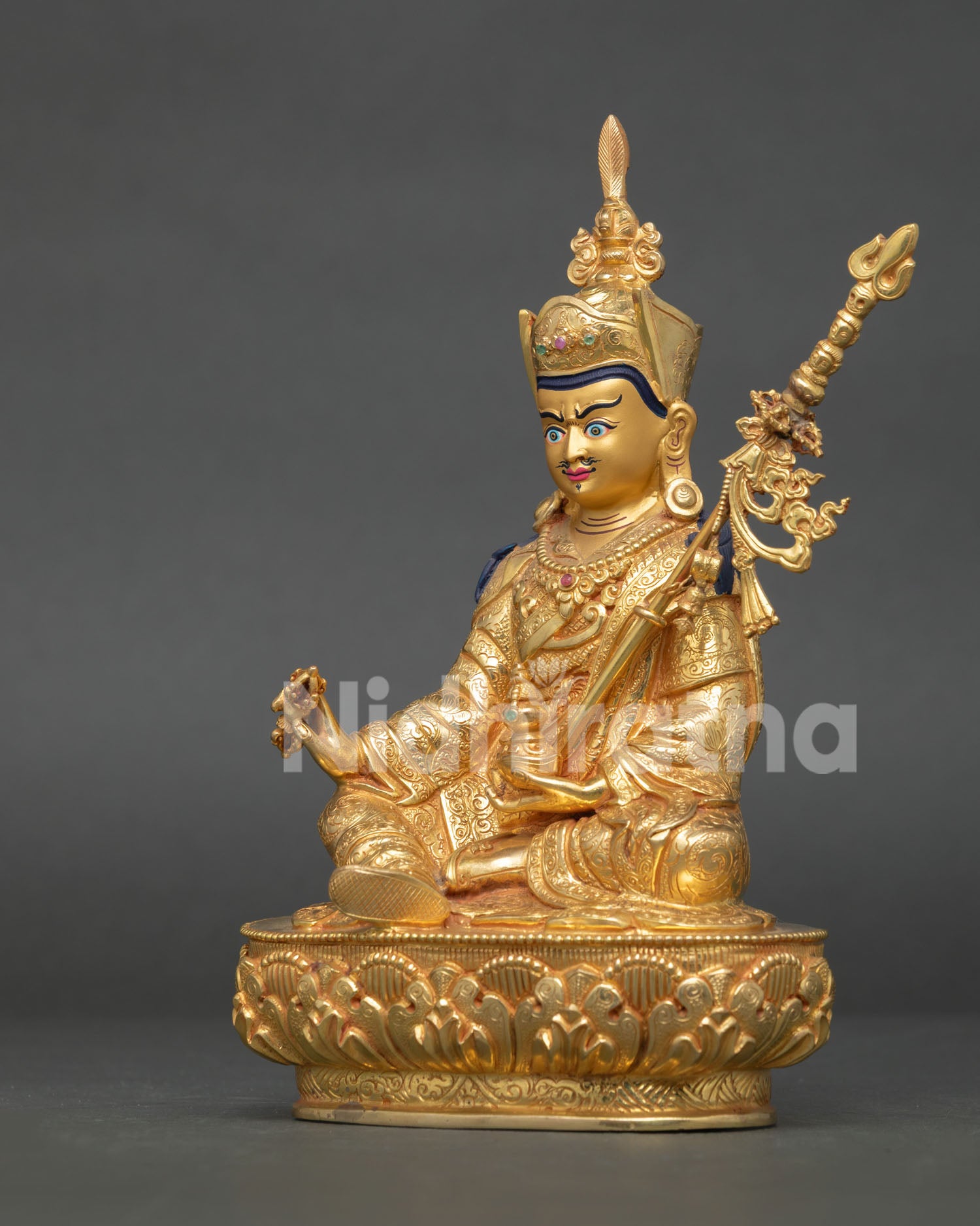 Guru rinpoche statue handcrafted in nepal with gold gilded copper body and lotus pedestal.