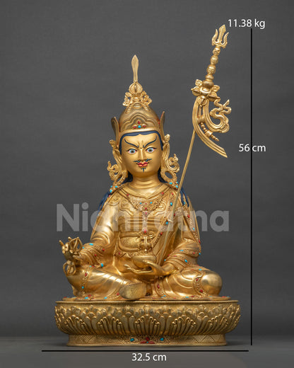 Guru Rinpoche statue in gold fire-gilded copper, Padmasambhava with vajra and khatvanga, front view