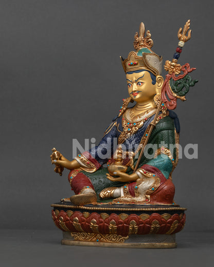 Guru Rinpoche Statue left side view showing kapala, long-life vase, and traditional Buddhist details