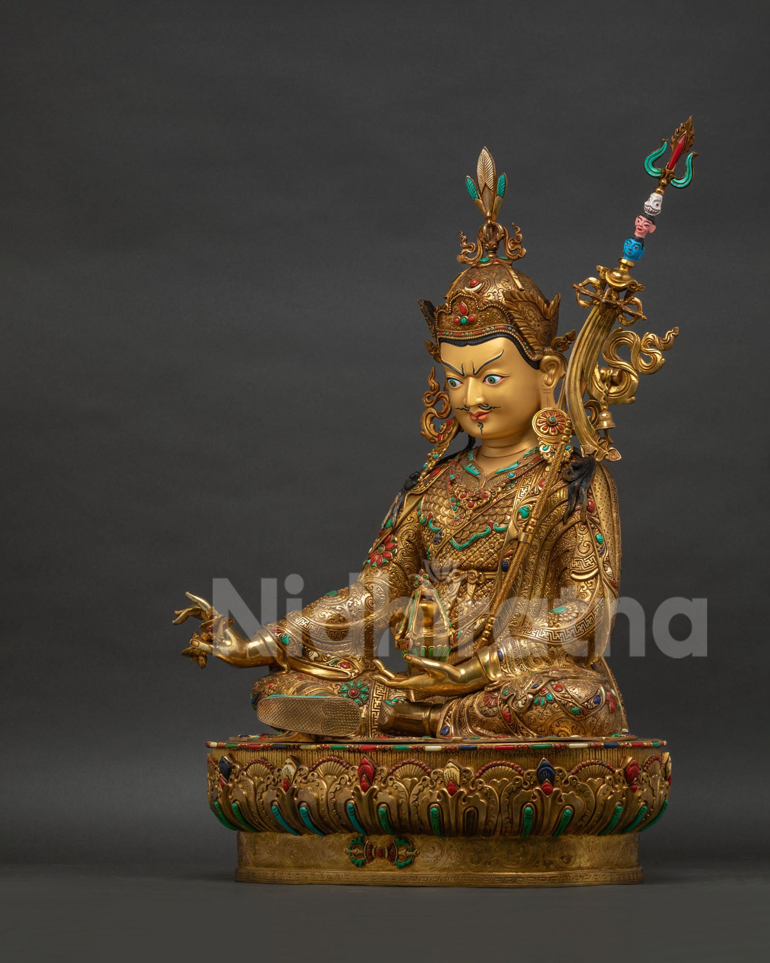 Guru Rinpoche statue left side view, skull cup nectar hand, semi-precious stone inlay
