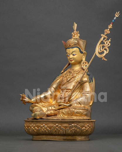 Guru Rinpoche Statue left side view skull cup vase and lotus pedestal.