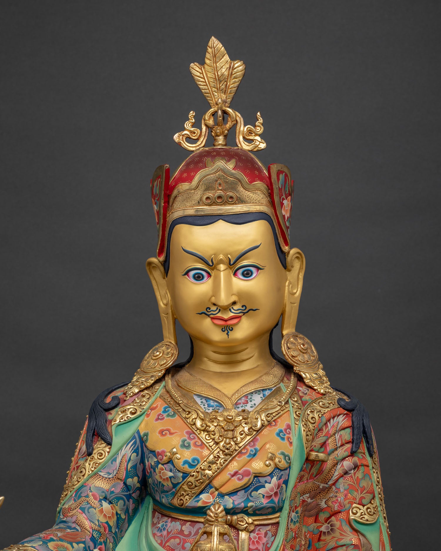 Guru Rinpoche statue regular close up showing vivid robes and intricate Nepalese metalwork