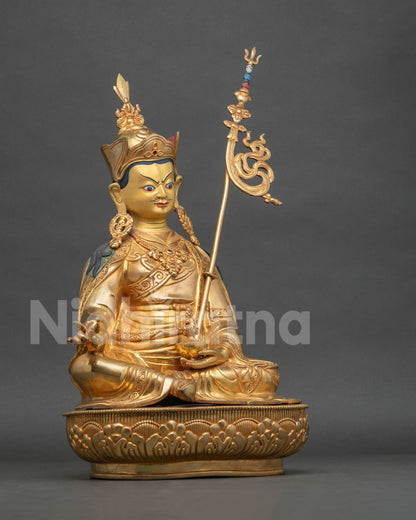 Guru Rinpoche Statue right side view vajra and khatvanga trident.