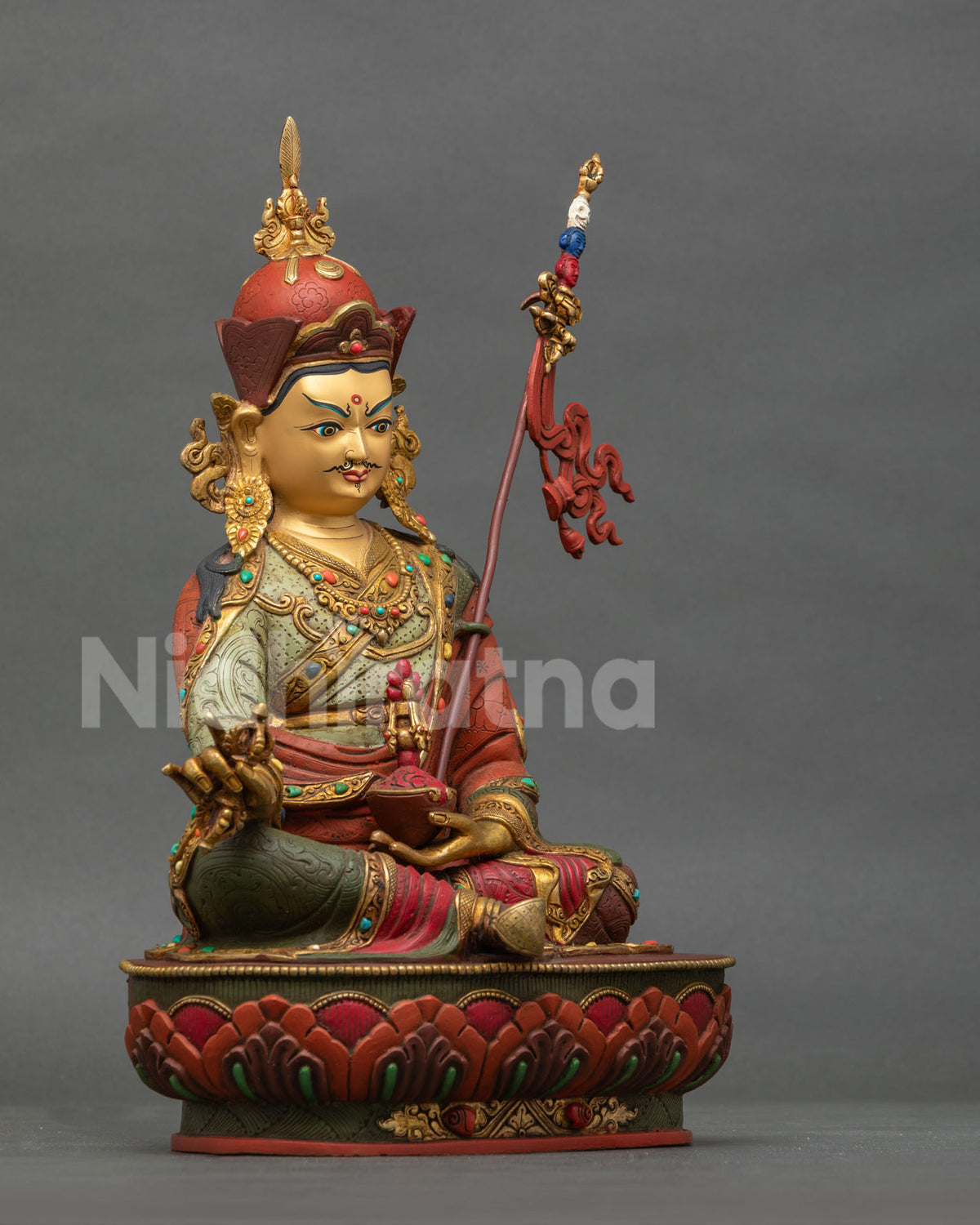 Guru Rinpoche Statue right side view vajra skull cup khatvanga staff.