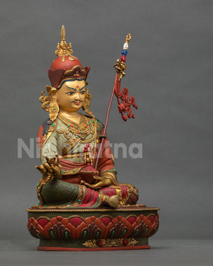 Guru Rinpoche Statue right side view vajra skull cup khatvanga staff.