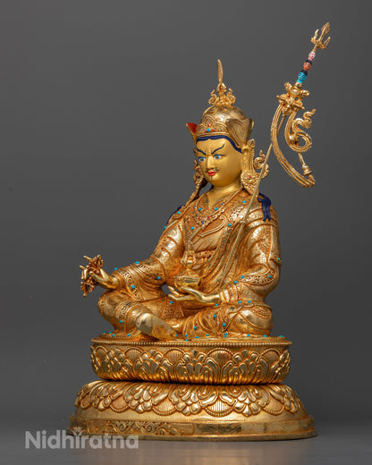 Guru Rinpoche statue seated on a hand-carved double lotus pedestal with semi-precious stones and ornate jewelry.
