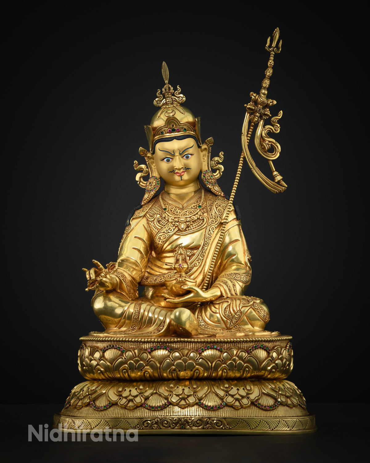 Guru Rinpoche statue showing hand cast copper alloy and gold fire gilding from Nepal