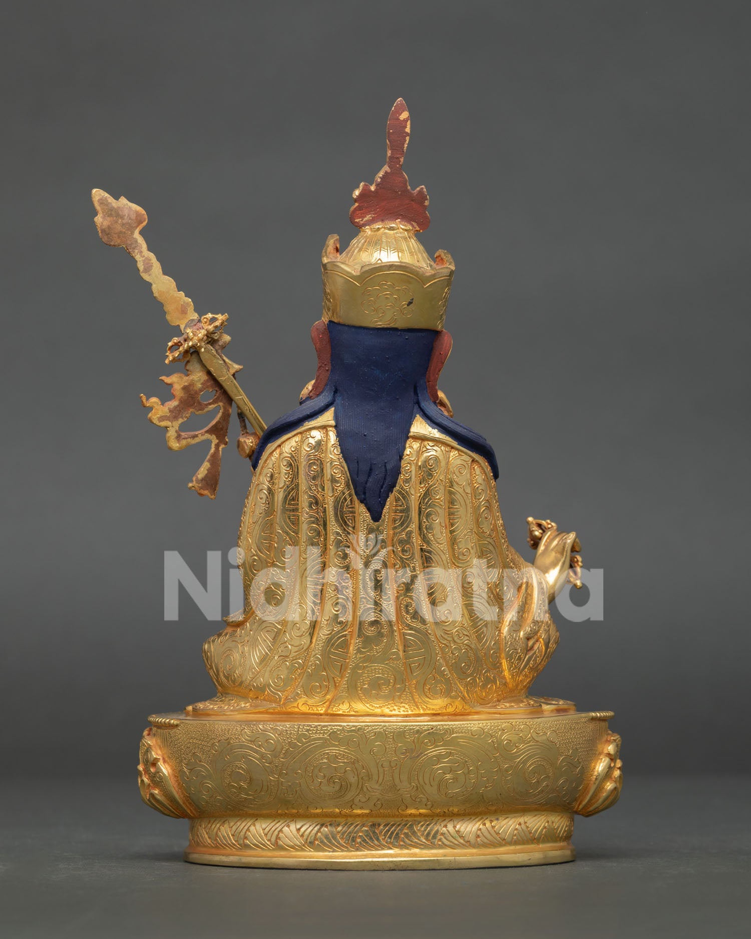 Guru rinpoche statue with flowing robes and traditional nepalese craftsmanship.