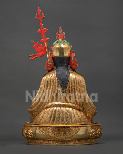 Guru Tsokye Dorje Statue back view, intricate repoussé robe, lotus pedestal and 24K gold gilding