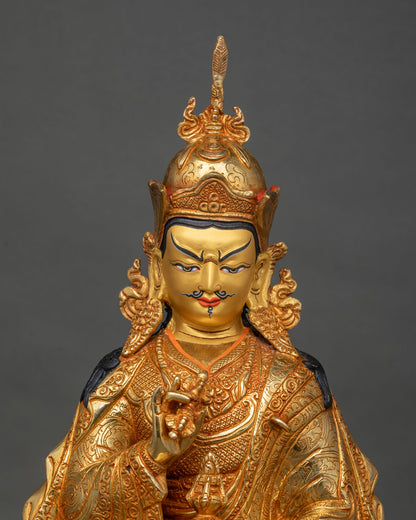 Guru Tsokye Dorje statue close-up of crown, face and Vajra hand gesture