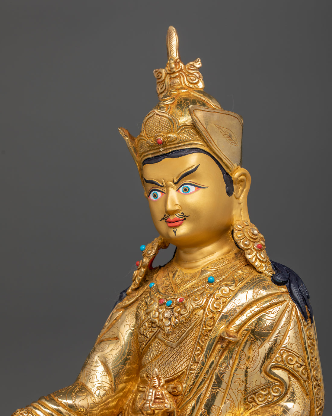 the side profile of head of guru Padmasambhava statue