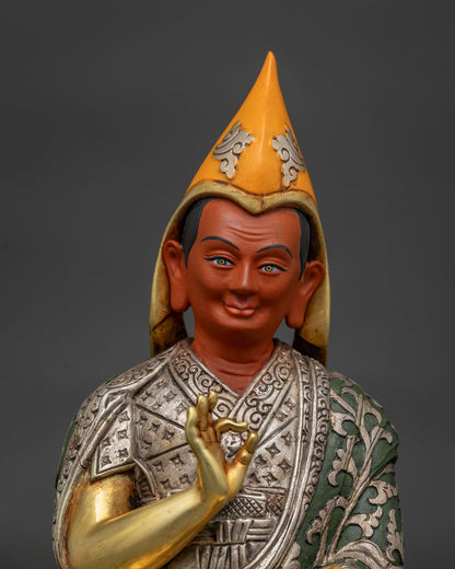 gyaltsab je statue face close up with yellow pandita hat serene expression and gold gilded features nepal
