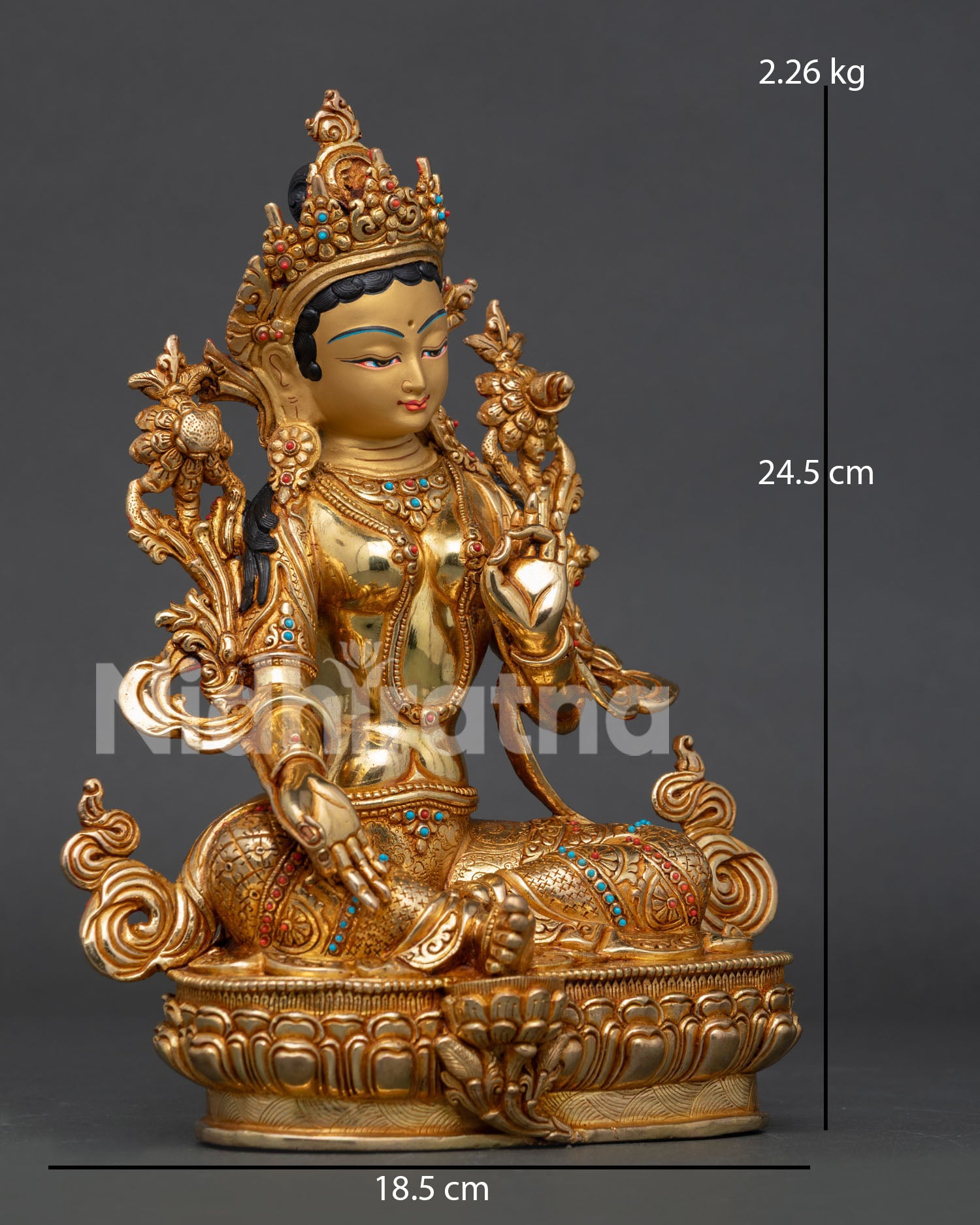 Handcarved Green Tara statue with Varada Mudra and floral silk garment.