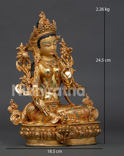 Handcarved Green Tara statue with Varada Mudra and floral silk garment.
