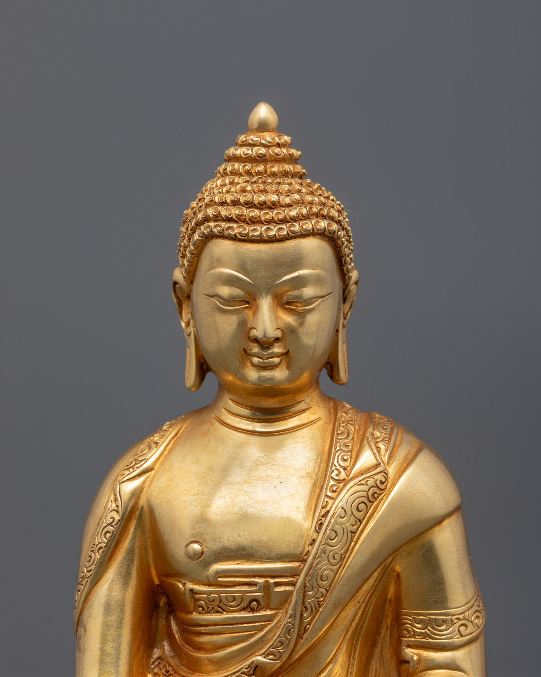 hand-carved Shakyamuni Buddha statue – showcases intricate robe detailing, gold fire-gilding, and sacred Tibetan craftsmanship using the lost wax method.