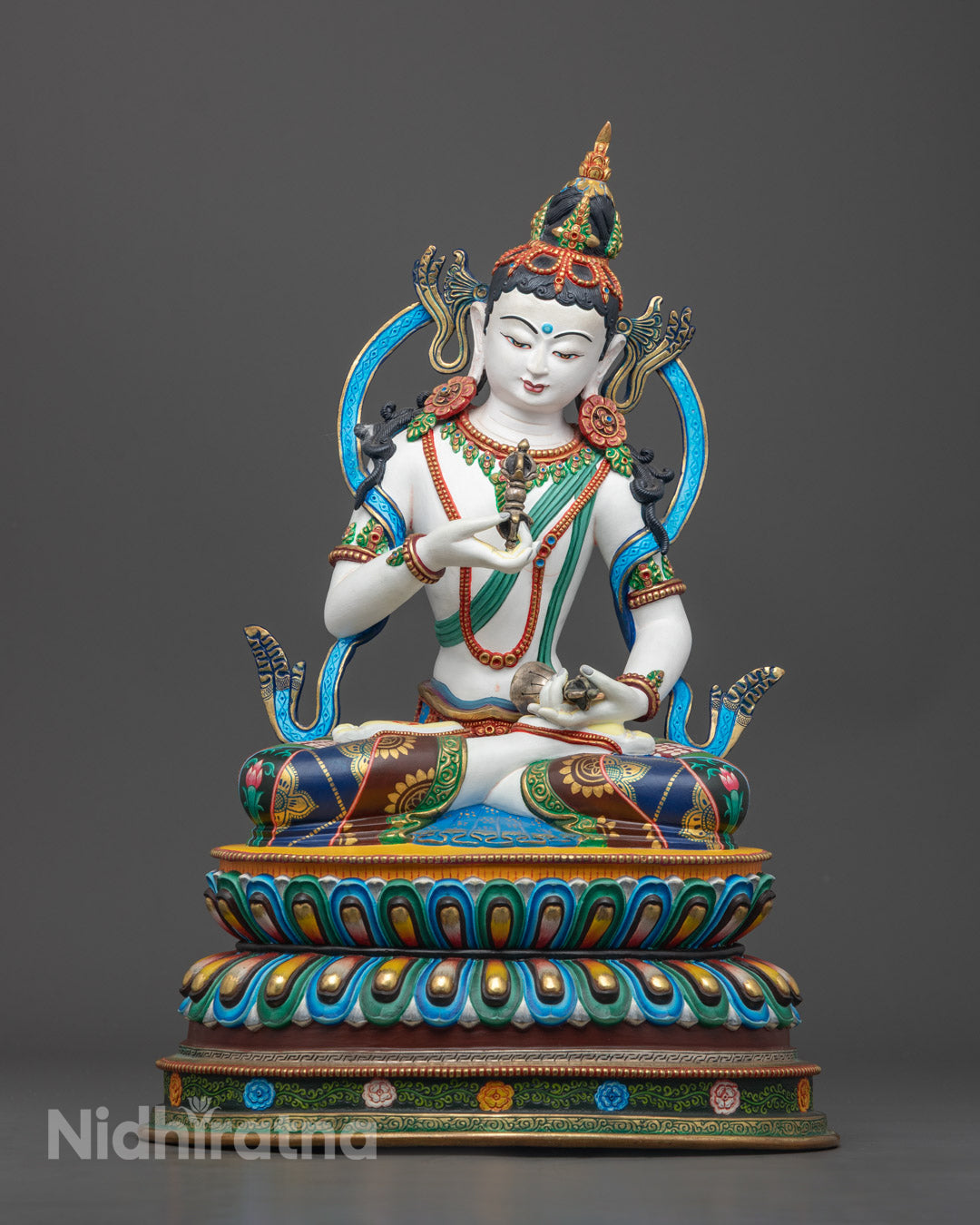hand-carved Vajrasattva statue seated on a double lotus seat, featuring a 24K gold-gilded face and vibrant acrylic detailing on copper.