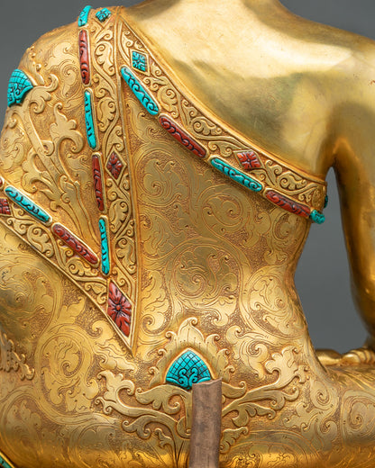 Hand-incised robe scrollwork with turquoise and coral inlay on Shakyamuni Buddha statue back