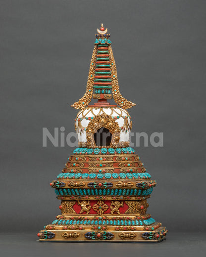 Hand-painted copper Tibetan stupa with gold-gilded repoussé and turquoise coral gemstone inlay, front view