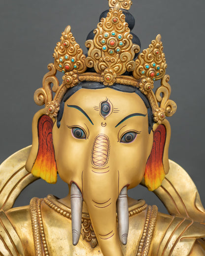 Hand-painted Ganesh face with fiery orange-red ears and gold crown inlaid with coral and turquoise