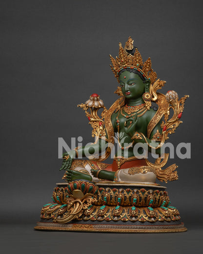 Hand-painted Green Tara statue left side view with utpala lotus flower and detailed geometric patterns