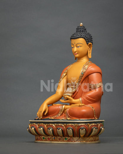 Hand-painted Shakyamuni Buddha statue holding an alms bowl, angled side view from Nepal