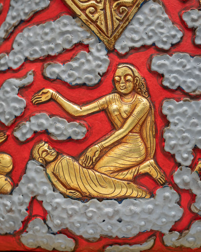 Hand-sculpted gold relief of a Maya Devi beside a reclining figure on the Shakyamuni Buddha statue robe