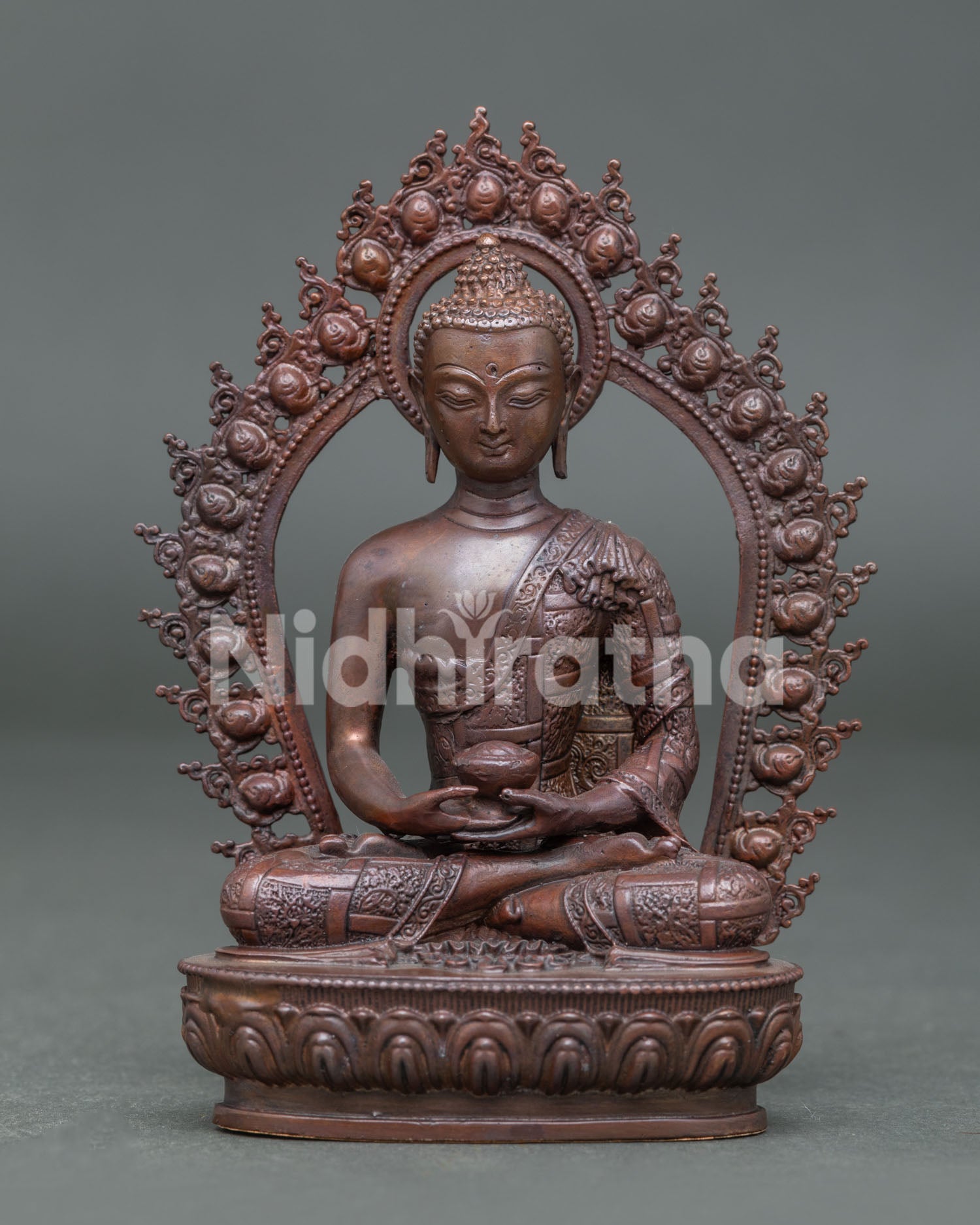 Handcrafted Amitabha Buddha statue from Nepal with oxidized copper finish seated on lotus pedestal