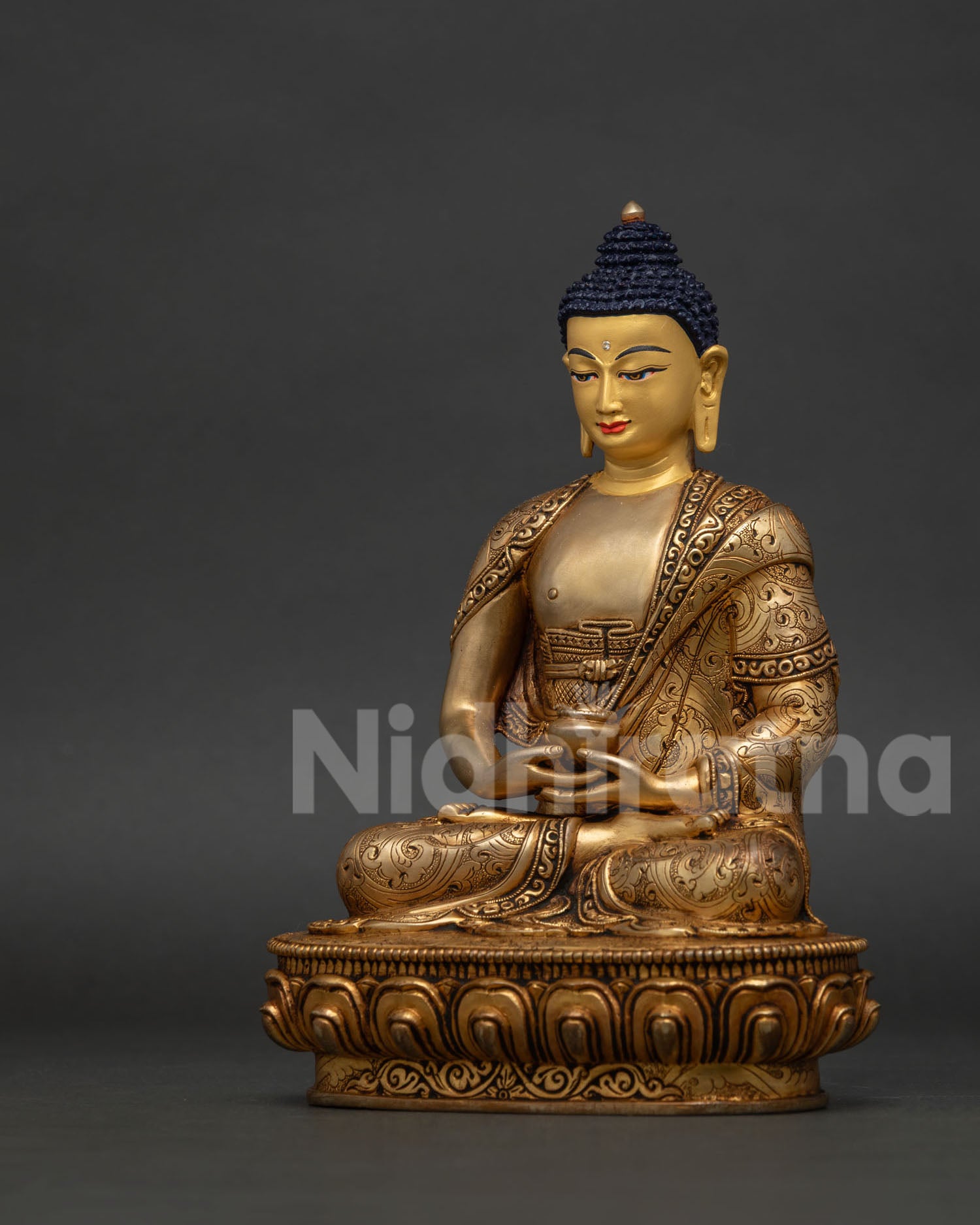 Handcrafted Amitabha Buddha statue from Patan Nepal with 24K gold painted face.