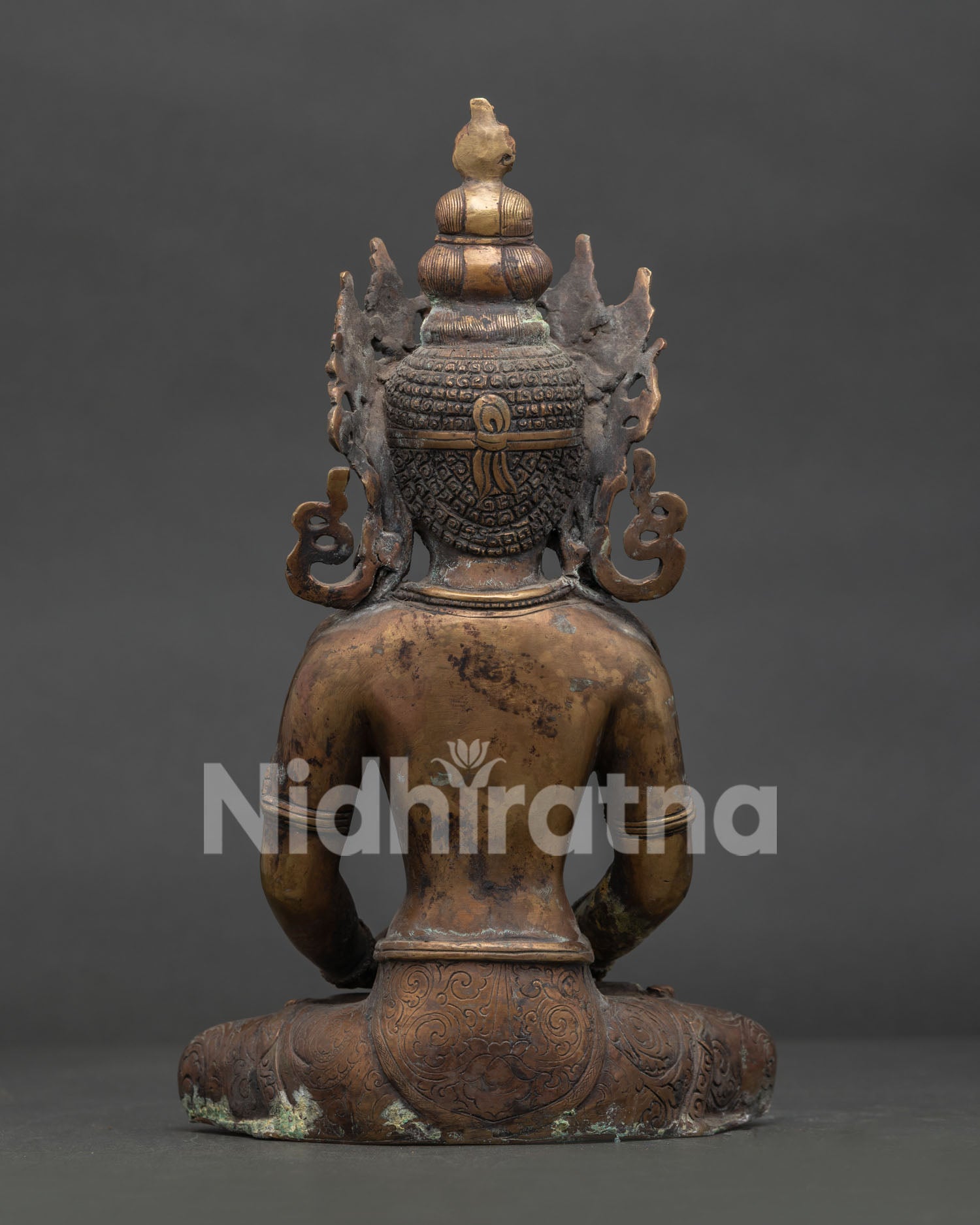Handcrafted Amitayus Buddha statue back view showcasing intricate Newari copper craftsmanship.