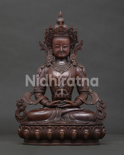 Handcrafted Amitayus statue in oxidized copper seated on a lotus pedestal front view.