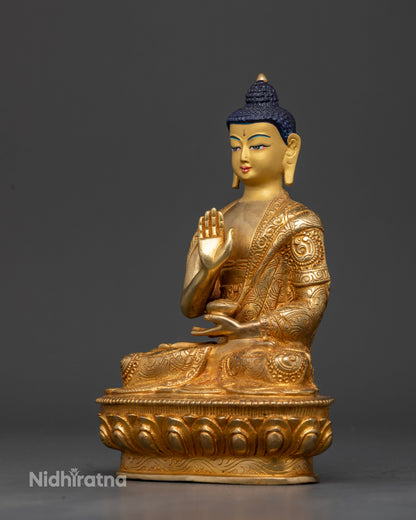 Handcrafted Amoghasiddhi Buddha Statue from Patan Nepal with gold-fire gilded body.