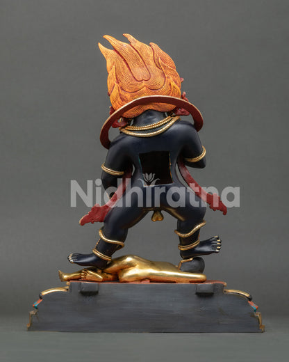 Handcrafted Black Dzambhala wealth god statue back view showing Himalayan ritual artwork details