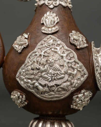Handcrafted Buddhist tea pot for altar offerings with auspicious symbols and floral engravings