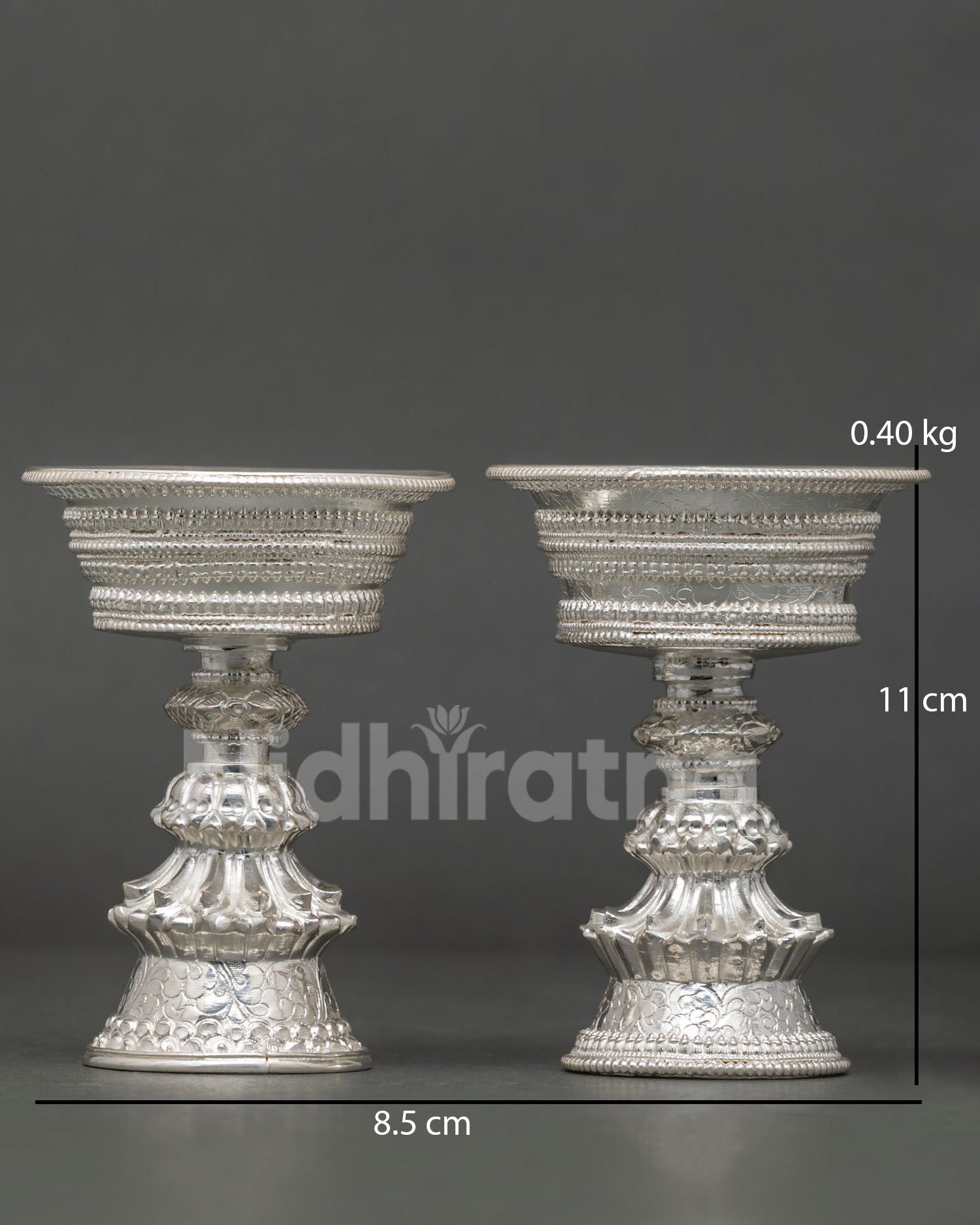 Handcrafted Butter Lamp from Patan Nepal with silver plated copper and patterned motifs.