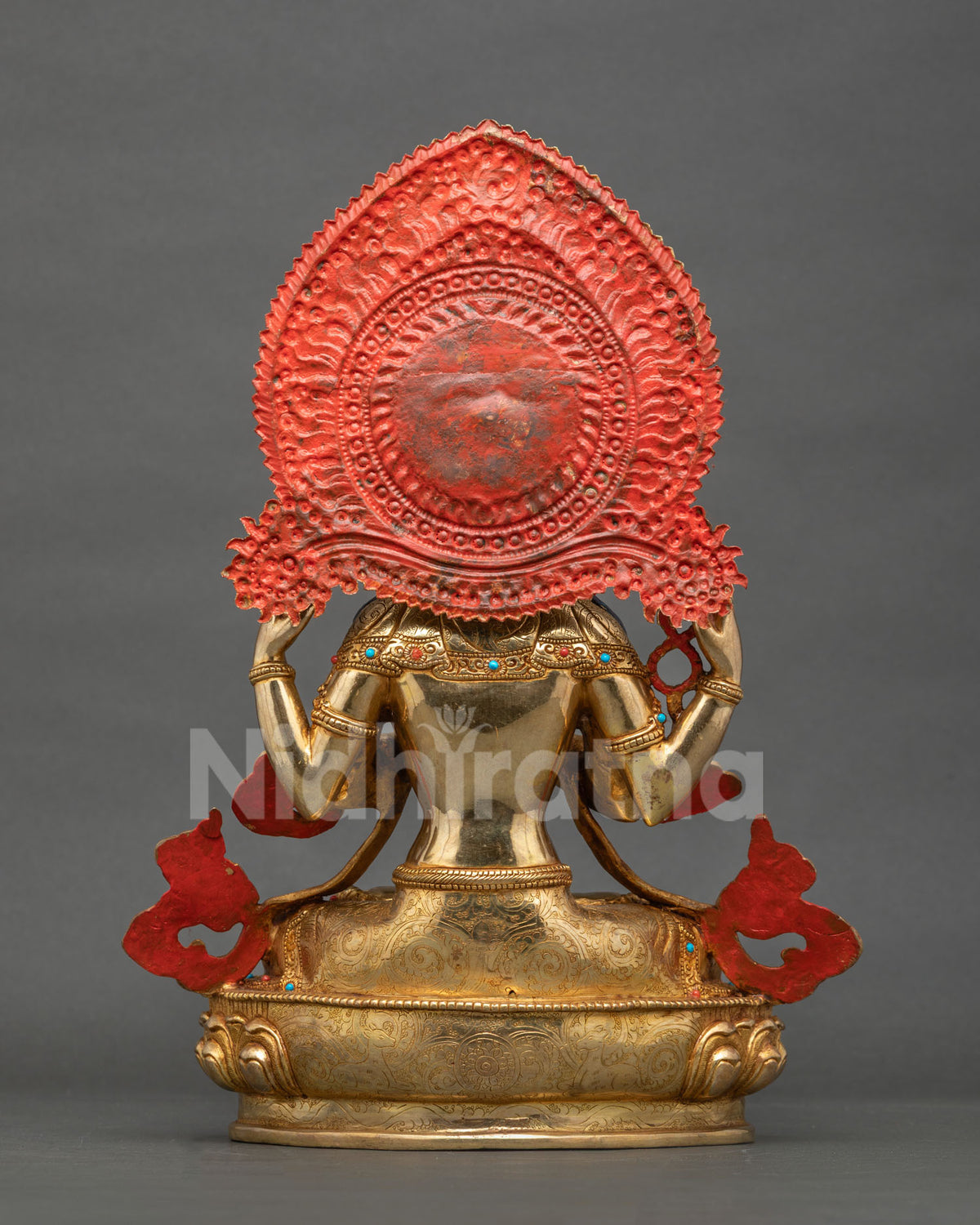 Handcrafted Chenrezig Buddhist statue with halo and lotus base in meditation room setting
