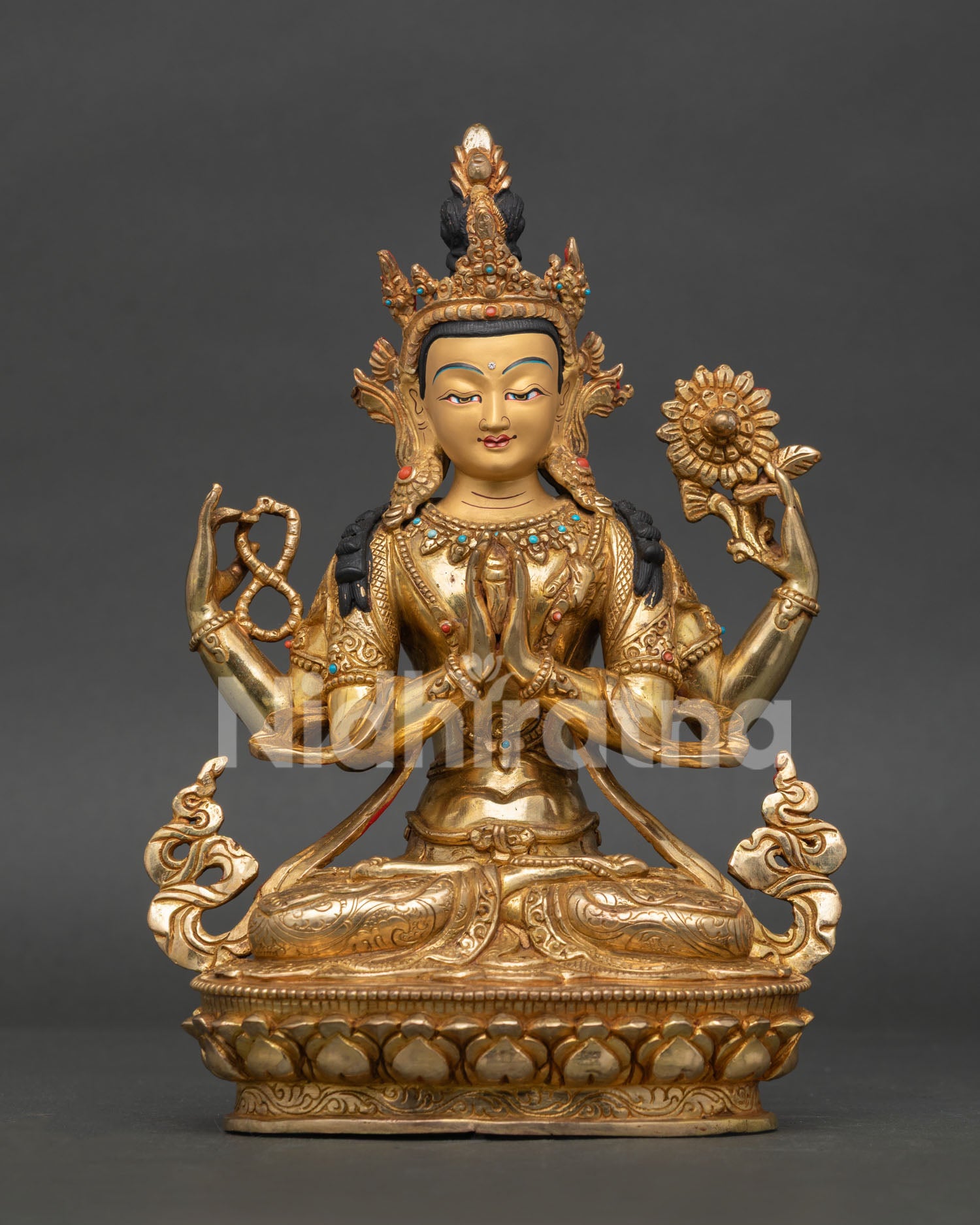 Handcrafted chenrezig statue with 24k gold-painted face gold-fire gilding and semi precious stone details.