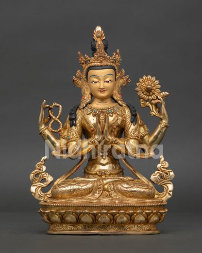 Handcrafted chenrezig statue with 24k gold-painted face gold-fire gilding and semi precious stone details.
