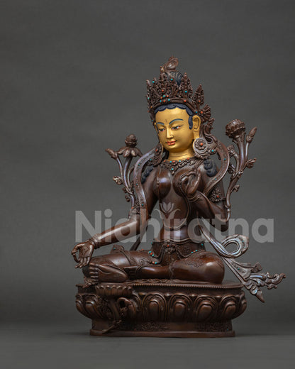 Handcrafted copper Green Tara Statue with chemically oxidized finish.