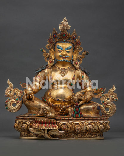 Handcrafted Dzambhala copper statue with gold-gilding, holding Chintamani jewel and jewel-spitting mongoose, Nepal