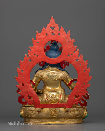 Handcrafted Dzambhala Statue from Patan, Nepal seated on an intricate lotus pedestal