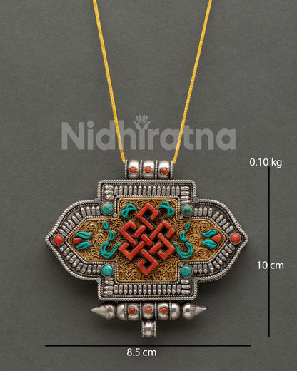 Handcrafted Endless Knot Ghau Mala features coral, turquoise, and gold-plated filigree artwork.