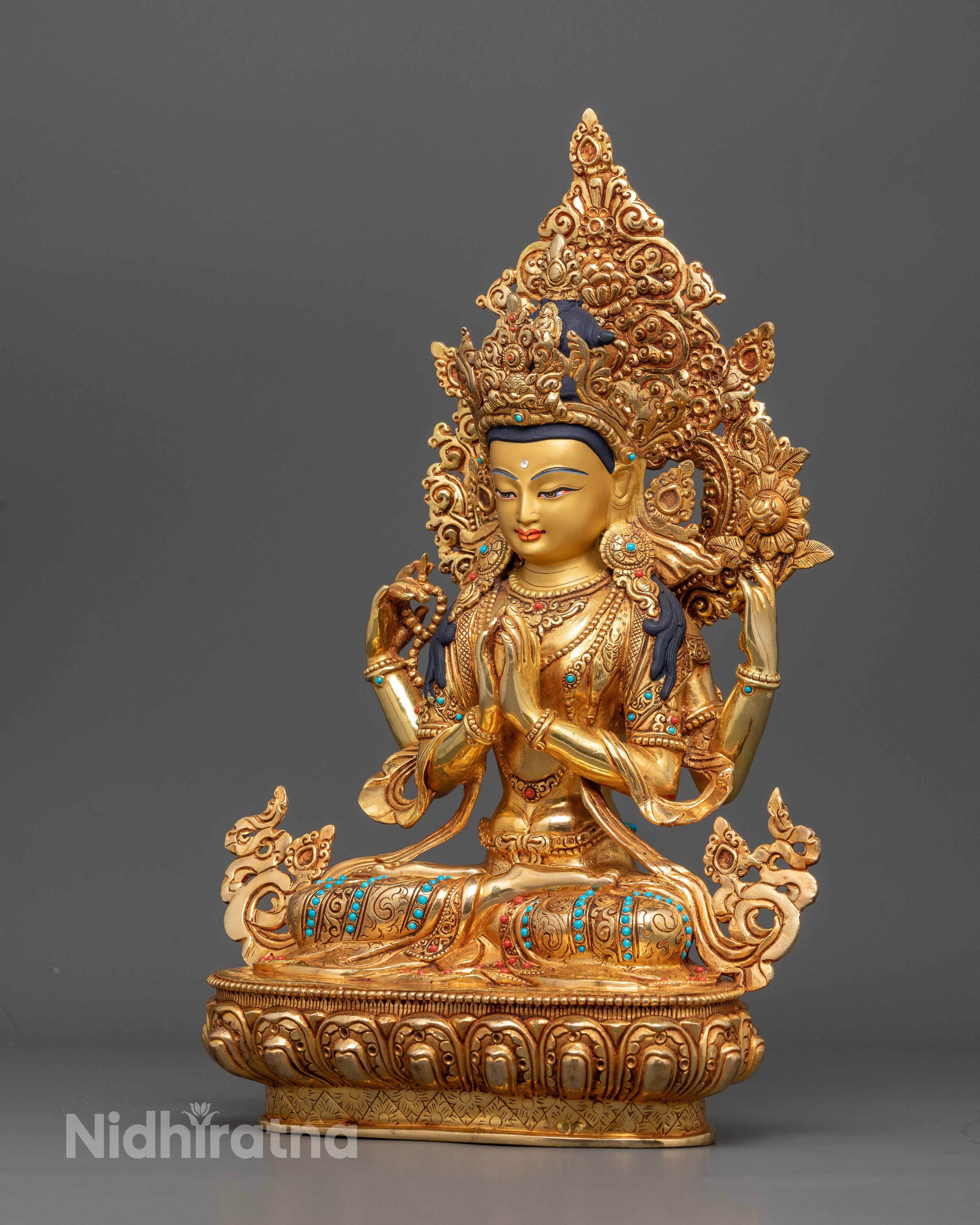 Handcrafted Four-Armed Chenrezig Statue Seated on Lotus Pedestal in Nepal.