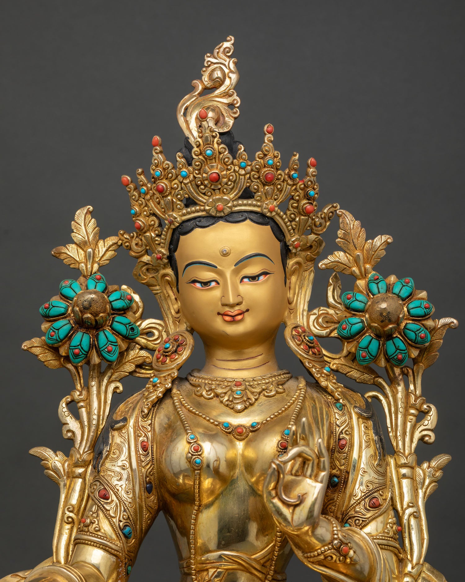 Handcrafted Green Tara Buddhist statue with gold painted, showing serene expression
