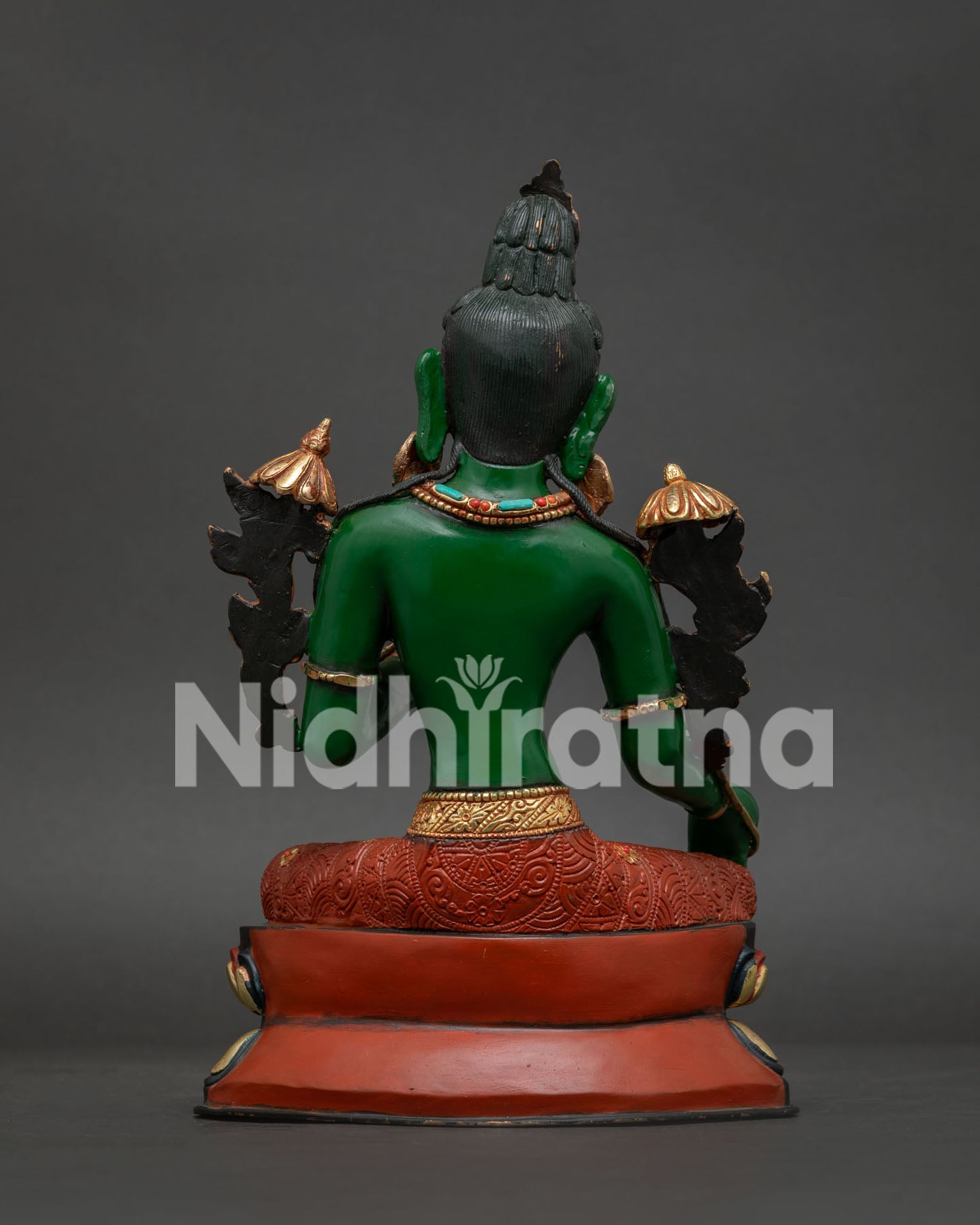 Handcrafted Green Tara statue back view showing intricate copper carving and ornaments