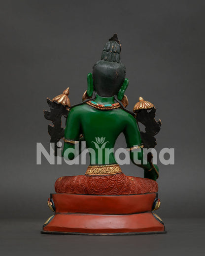 Handcrafted Green Tara statue back view showing intricate copper carving and ornaments