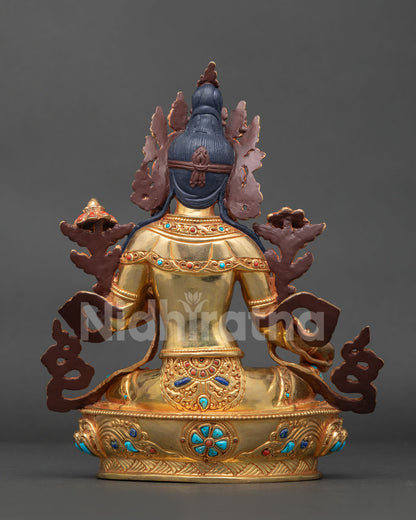 Handcrafted Green Tara statue from Patan Nepal with jeweled ornaments gold gilding and carved lotus pedestal.