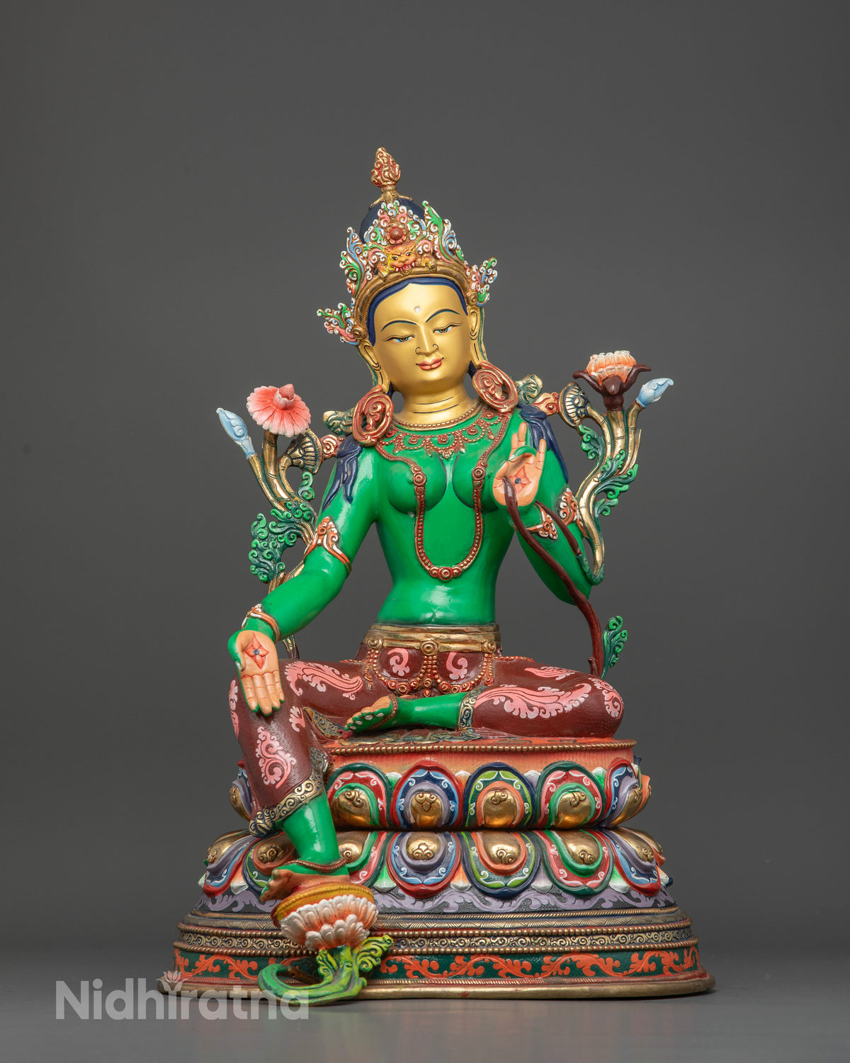 Handcrafted Green Tara statue in copper with acrylic painted body from Patan Nepal.