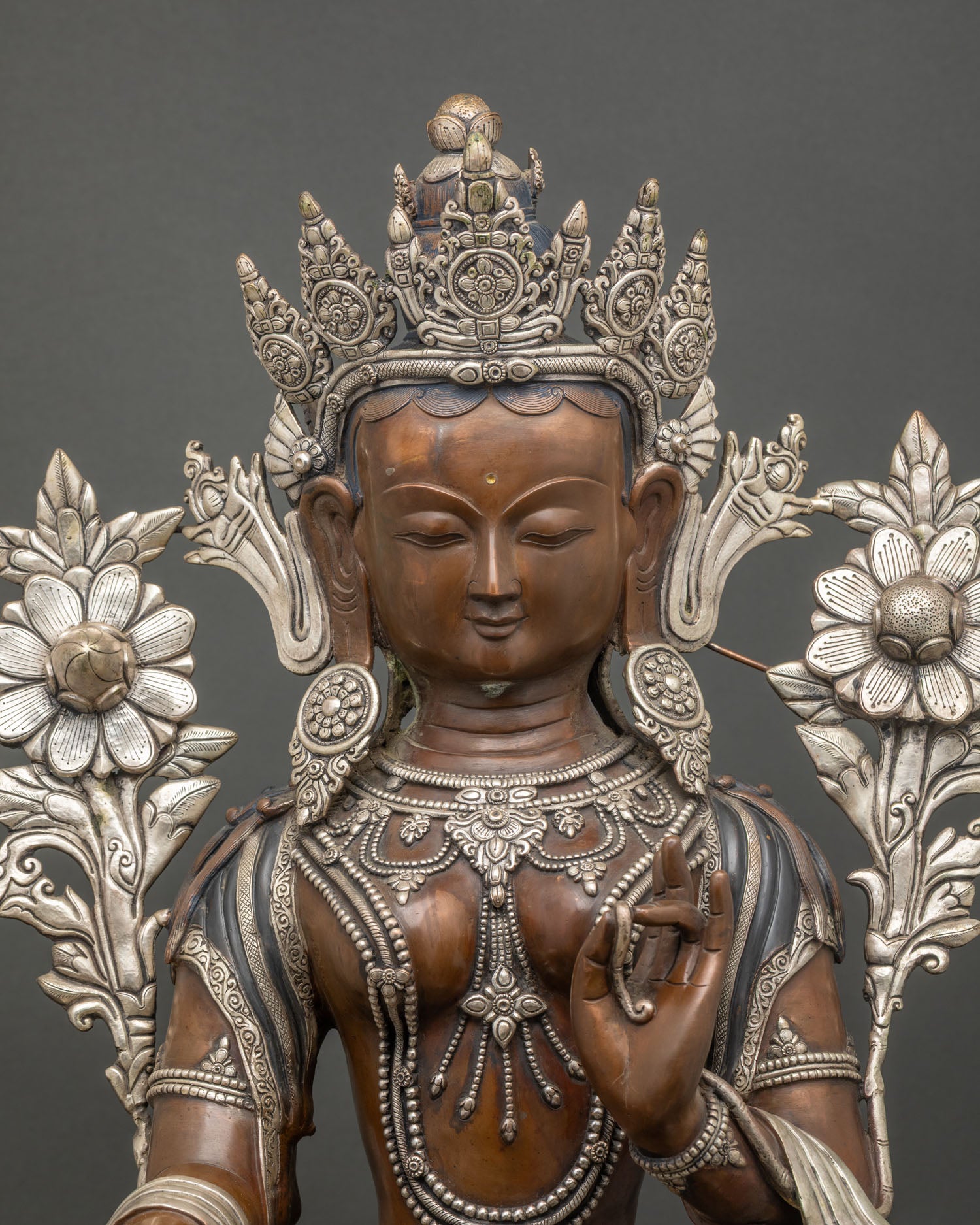 Handcrafted Green Tara Statue in oxidized copper with intricate silver ornaments and lotus throne