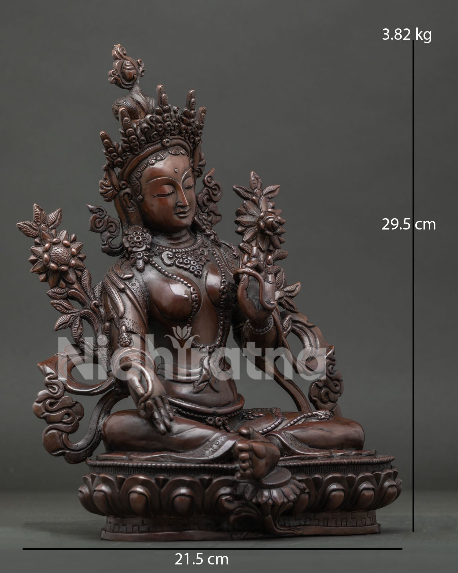 Handcrafted Green Tara Statue with extended right leg and sacred blue utpala lotus.