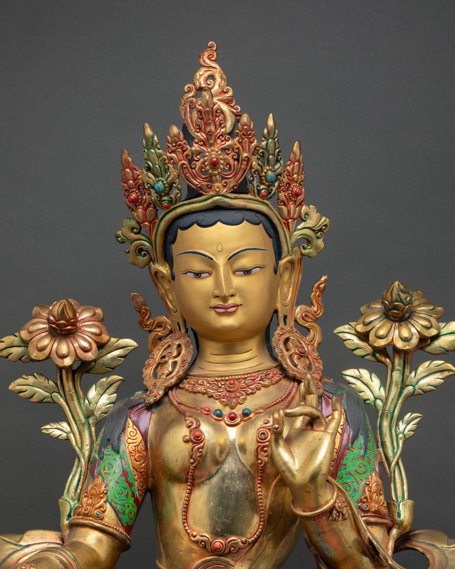 Handcrafted Green Tara statue with sacred jewels floral motifs and Himalayan Buddhist art